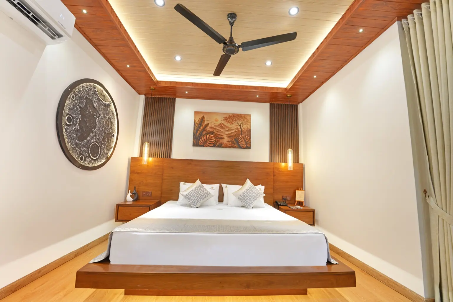 King-size bed and warm wood interior at Sivora Hills